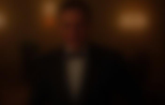 Man wearing a hired tuxedo at an event